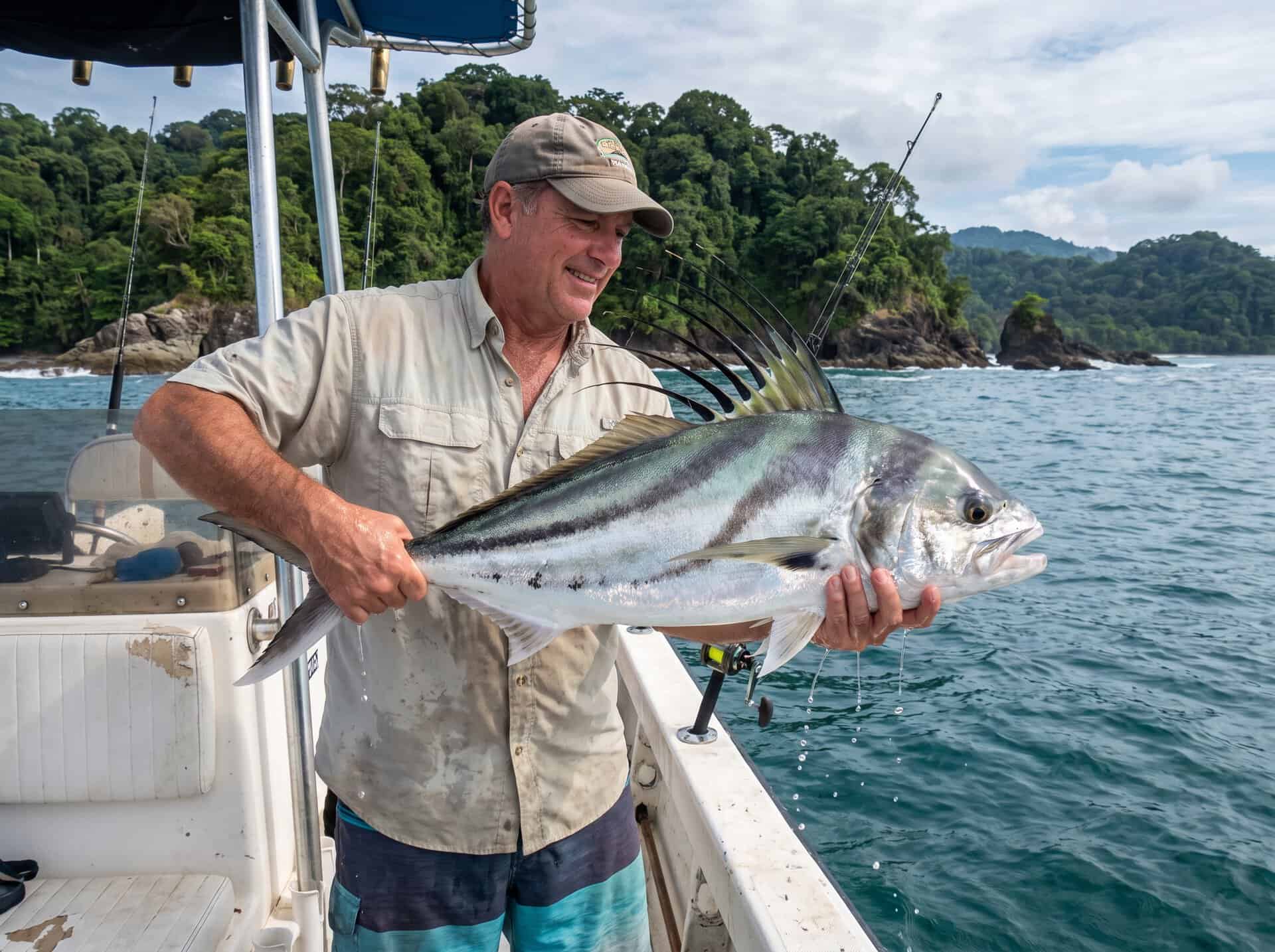Angler holding Roosterfish during inshore fishing in Quepos Costa Rica